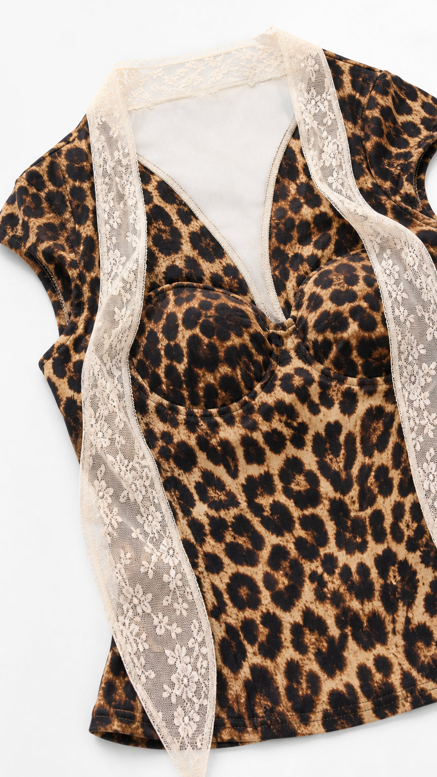 Flat lay close-up of brown leopard print sweetheart bustier crop top with white floral lace trim