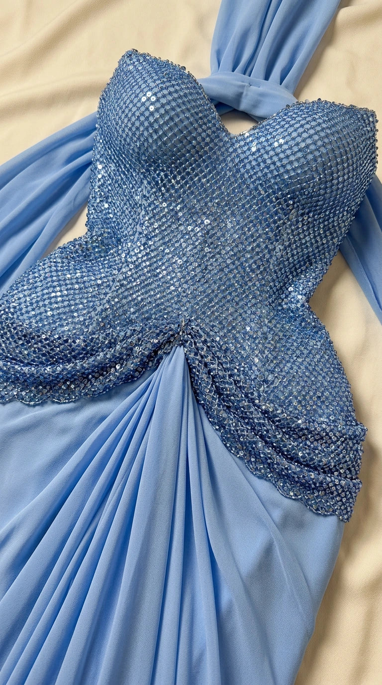 Close-up detail of beaded crystal bodice and ruched skirt on sky blue gown