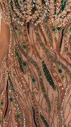 Close-up detail of intricate beadwork, stones, and sequins on bodice
