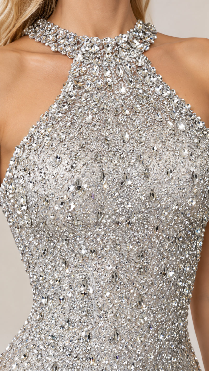 Close-up detail of rhinestone and crystal embellishments on the halter neckline