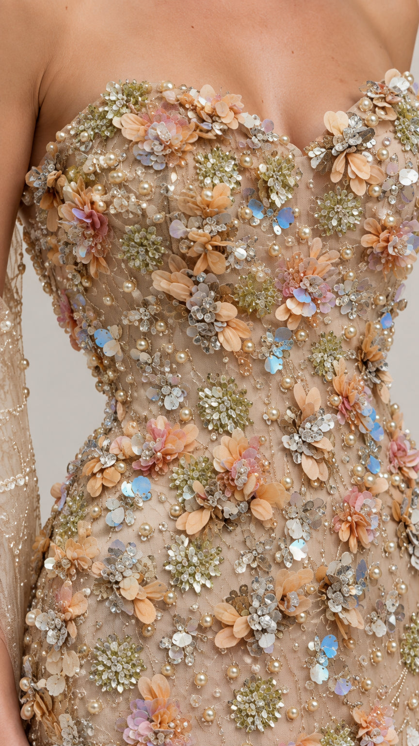 Close-up detail of 3D floral applique, beading, and sequin bodice embellishments