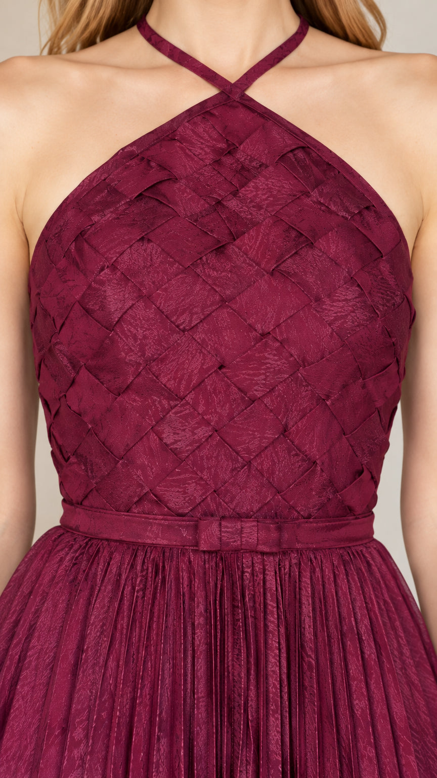 Close-up detail of the woven lattice bodice and pleated waistband on the Wine formal gown