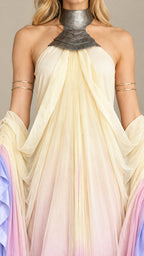 Close up of sculpted metallic halter neckpiece and pleated neckline drape