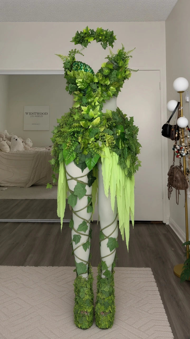 Full front mannequin display of the green leaf fairy top, skirt overlay, and printed leaf tights