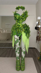 Full front mannequin display of the green leaf fairy top, skirt overlay, and printed leaf tights