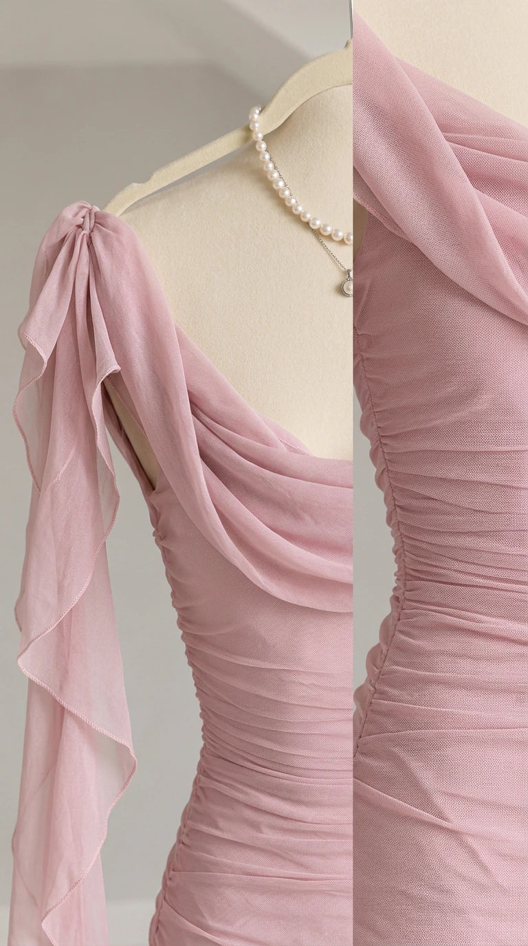 Close-up detail of dusty pink ruched mesh fabric and draped cowl neckline on a mannequin