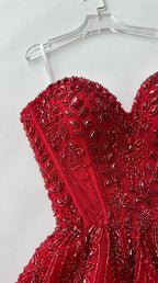Close-up detail of red floral beading and structured corset boning