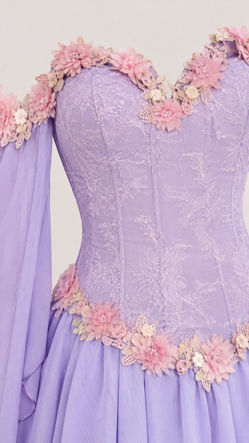 Close-up detail of 3D floral trim and lace embroidery on lavender corset bodice