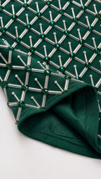 Close-up detail of geometric tube beads and lining on Emerald Green gown