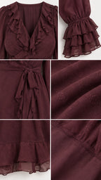 Close-up details of burgundy ruffle neckline, tiered cuff sleeves, waist tie, and textured fabric