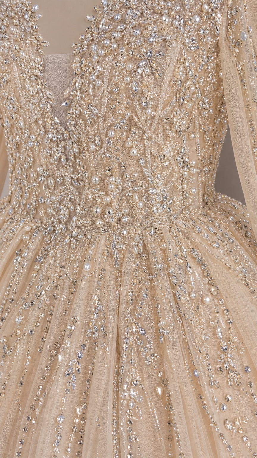 Close-up detail of intricate crystal and rhinestone embellishment on bodice