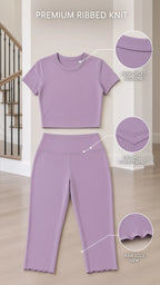 Product detail diagram highlighting ribbed knit, reinforced neckline, V-waistband, and raw edge hem