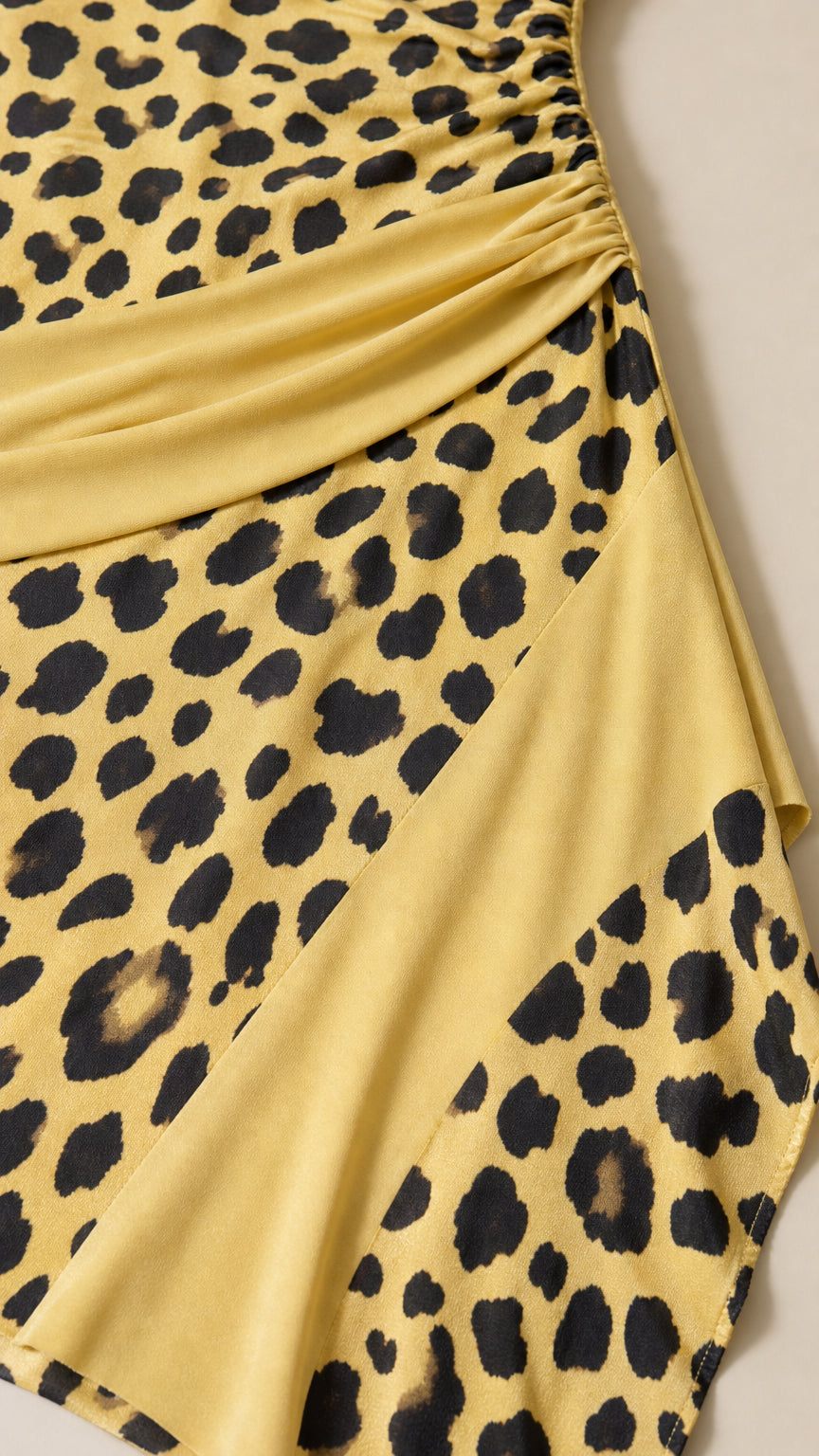 Close up detail of ruched waistband and leopard print pattern