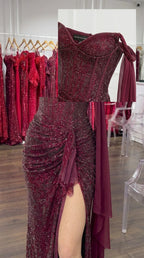 Close-up detail of structured sweetheart corset bodice and cascading ruched gathering with glitter finish