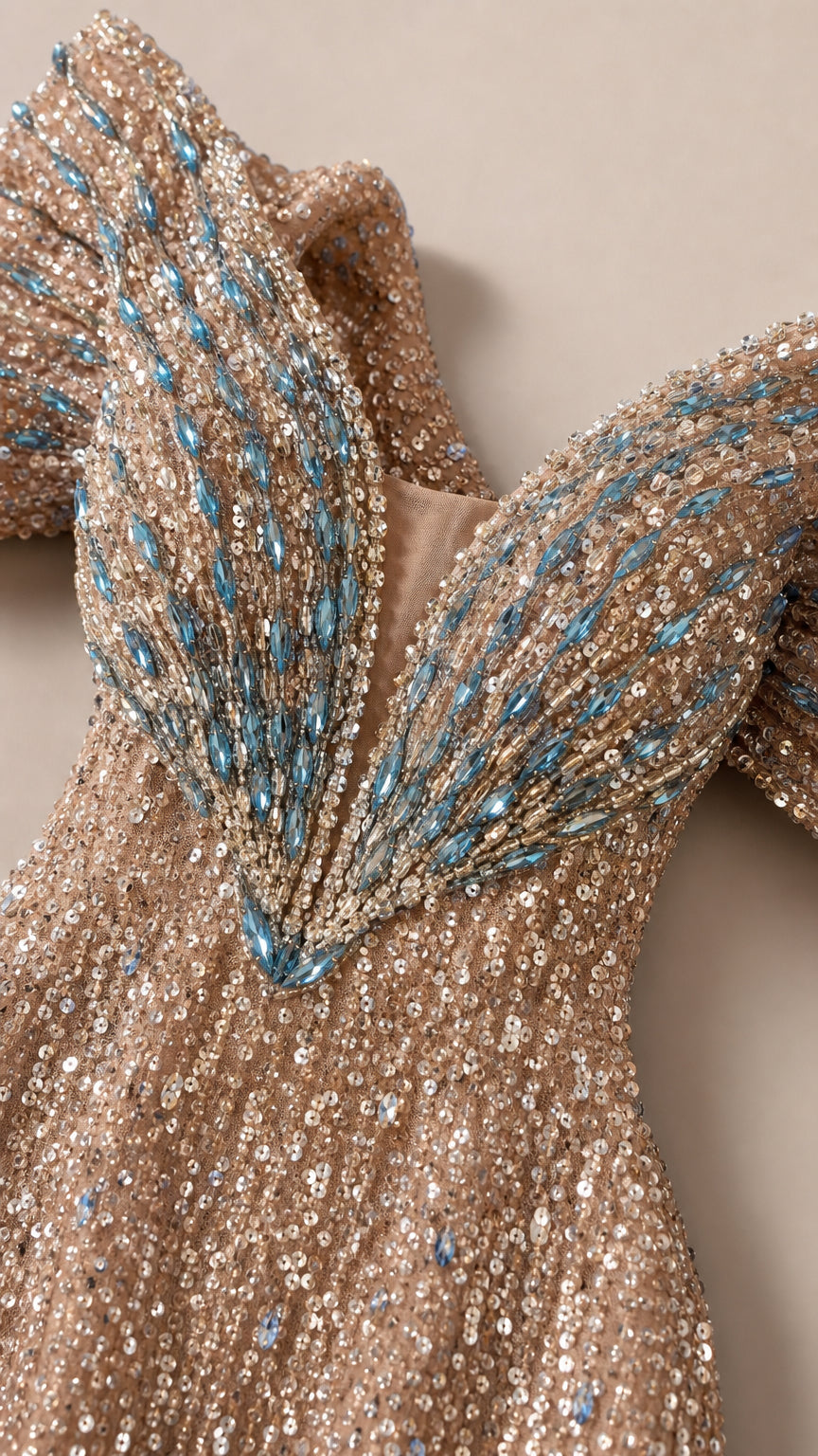 Close-up detail of bodice sequin embellishment and blue-accented crystal beadwork