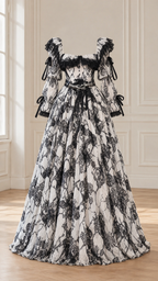 Ghost mannequin display of white and black Victorian puff sleeve ball gown with lace motif
