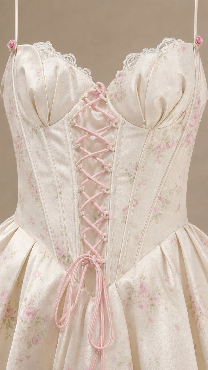 Close-up of sweetheart neckline, lace trim, and corset lace-up ribbon detail
