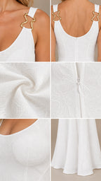 Close-up details of white dress fabric texture, gold strap hardware, and zipper closure