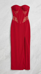 Flat lay view of red strapless corset evening dress with side slit