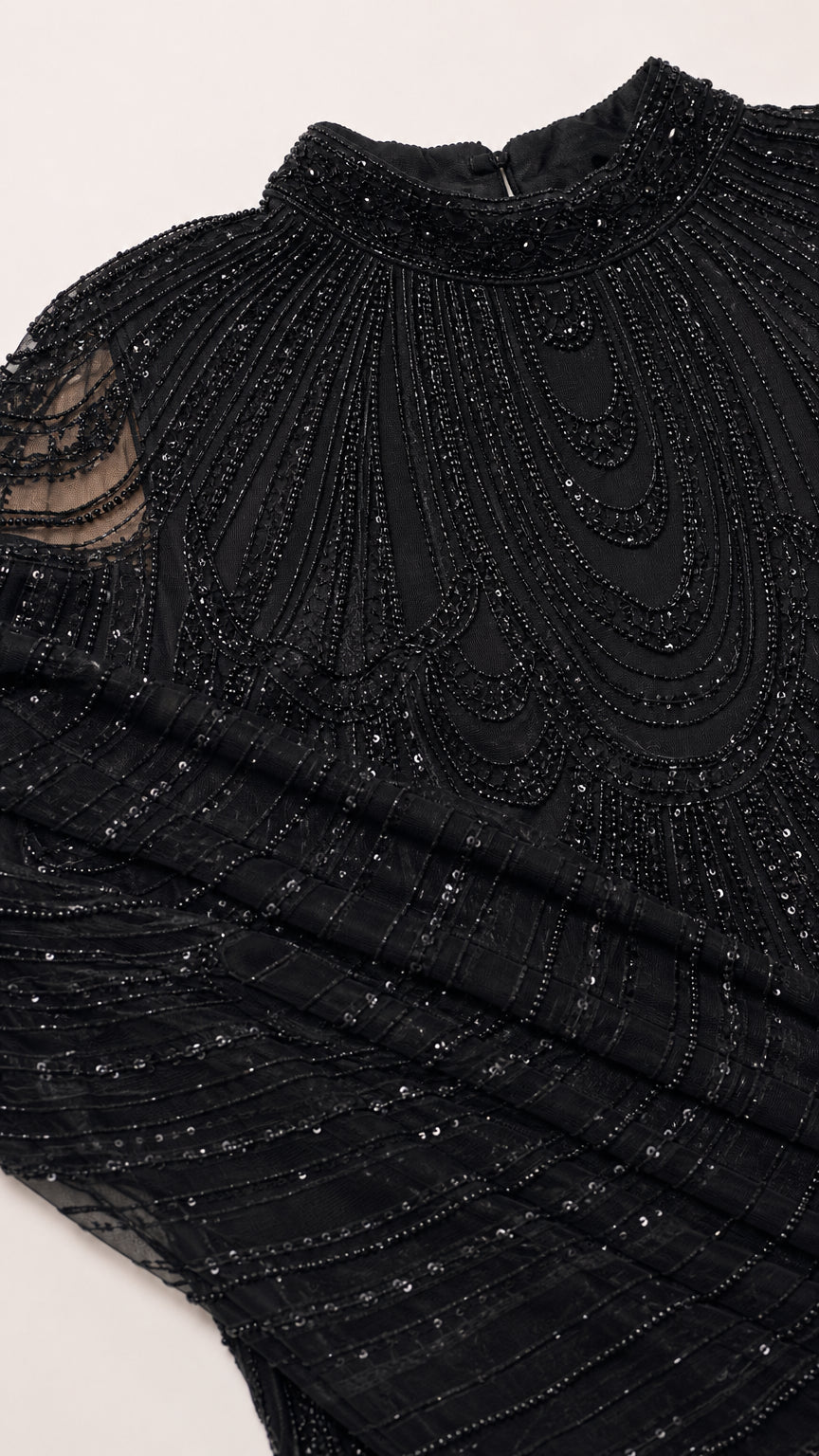 Close-up detail of intricate high neck beadwork and sequin embellishments