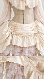 Close-up detail of cream corset bodice stitching, drawstring gathers, and layered tulle ruffles