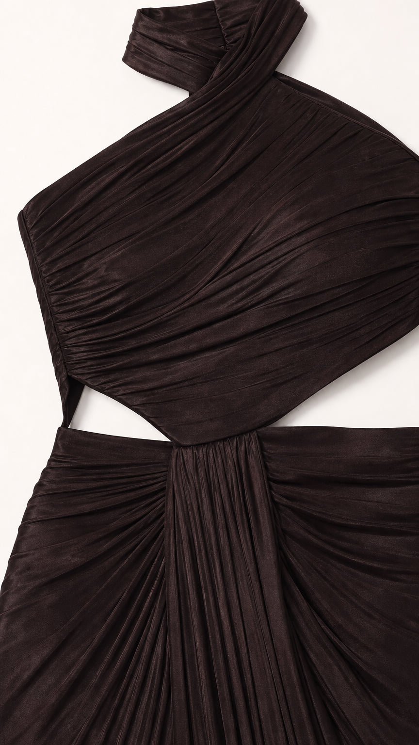 Close-up detail of pleated ruching and waist cutout on black evening gown