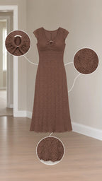 Detailed flat lay of brown textured midi dress showing neckline ring cutout and crinkle fabric