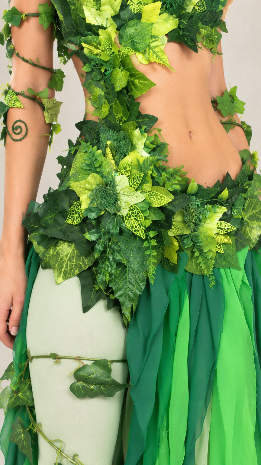 Close-up detail of faux foliage appliqués and textured sequin bodice embellishments