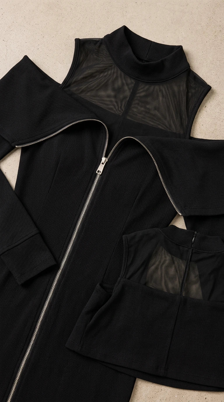 Close-up detail shot of black mesh neckline and front metal zipper closure