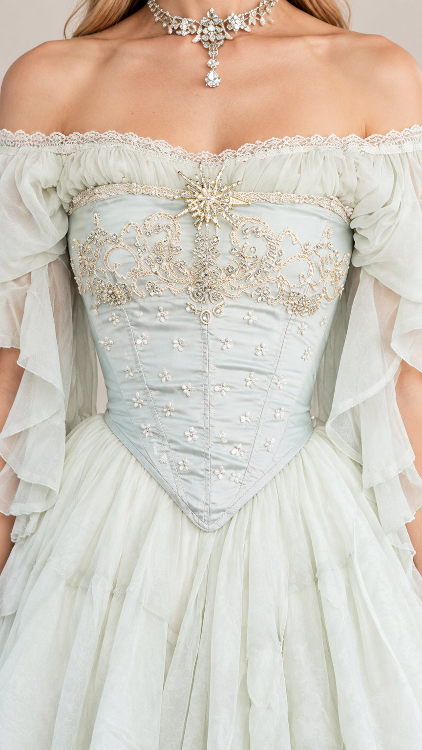 Close-up detail of embroidered and beaded basque corset bodice on mint green gown