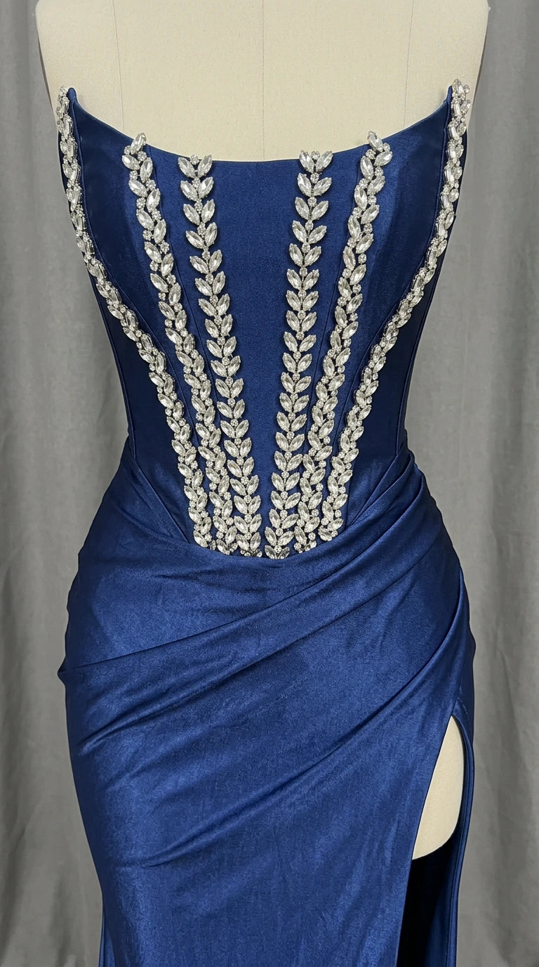 Mannequin close-up showing crystal leaf detailing on royal blue corset bodice