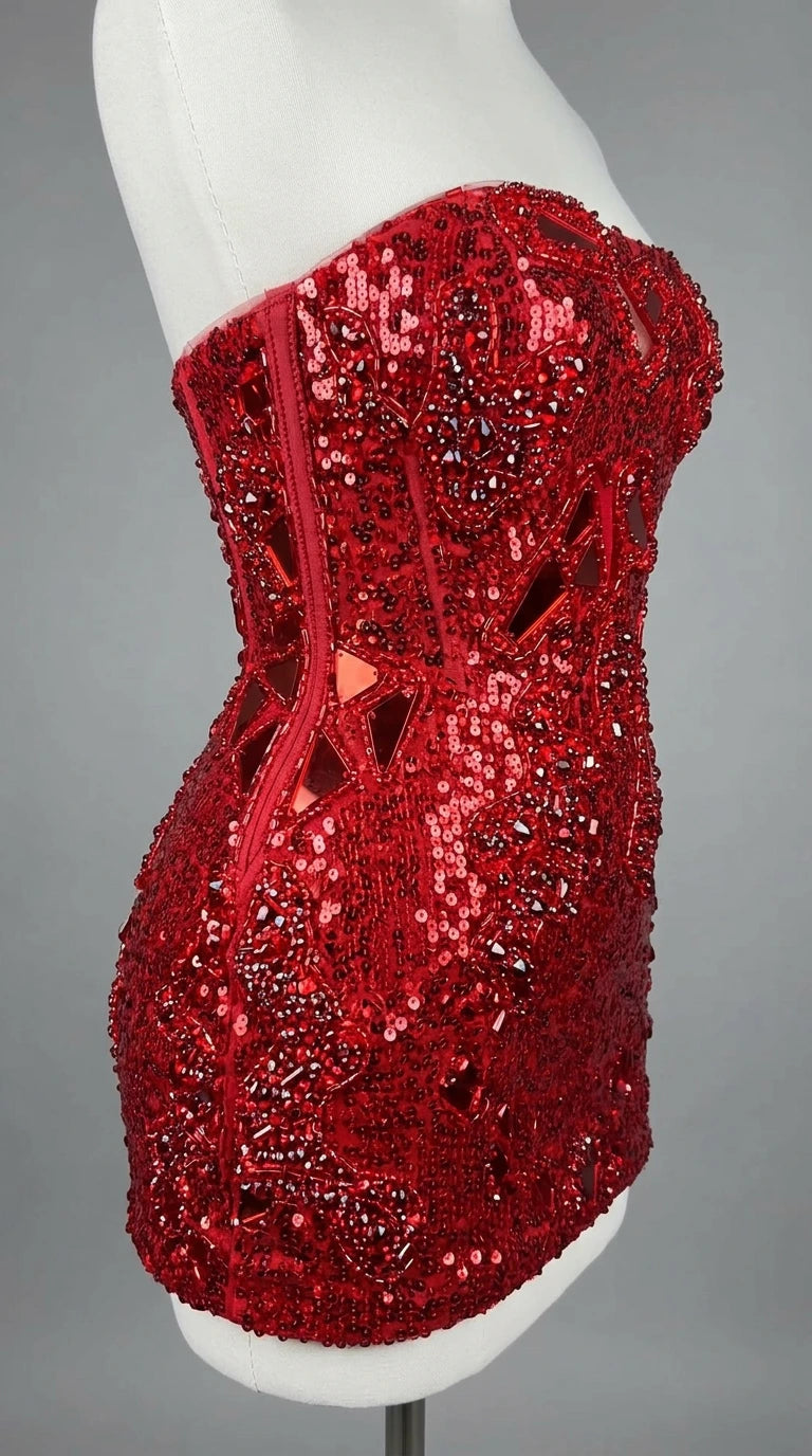 Close-up mannequin view of red sequin dress showing corset boning details