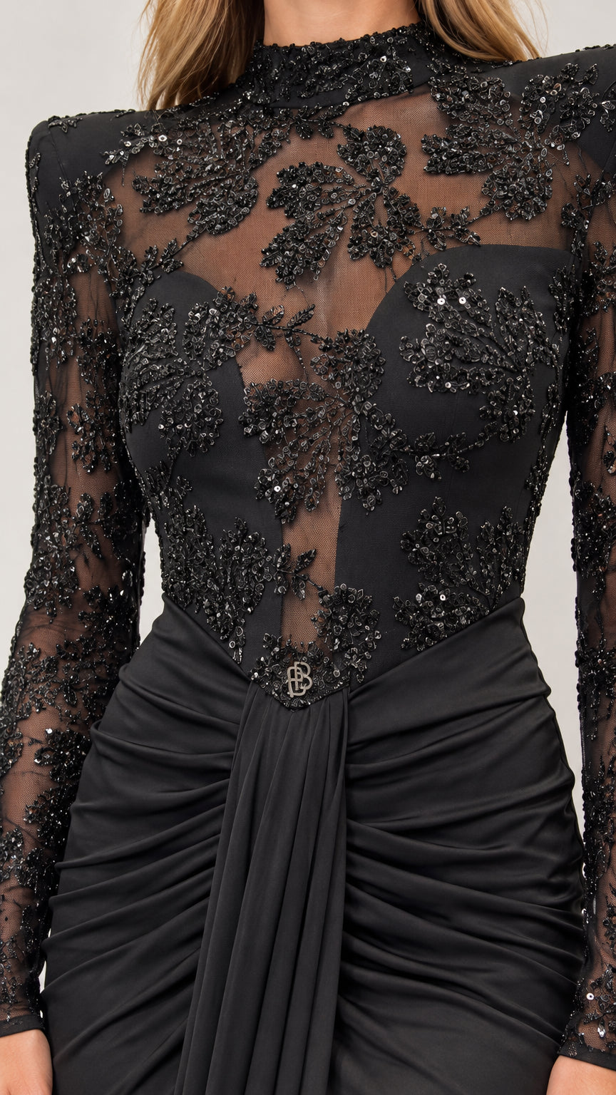 Close-up of floral embellishment and ruched bodice on black evening dress
