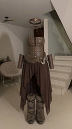 Flat product layout of the brown Viking warrior costume set including lace-up corset and handkerchief skirt