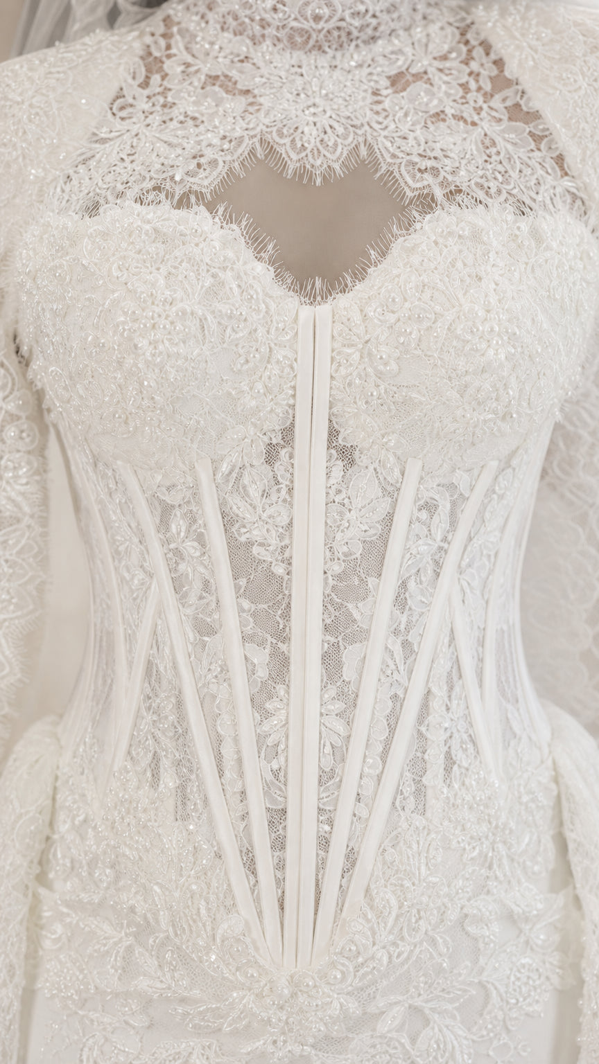 Close-up detail of illusion sweetheart neckline and corset boned bodice