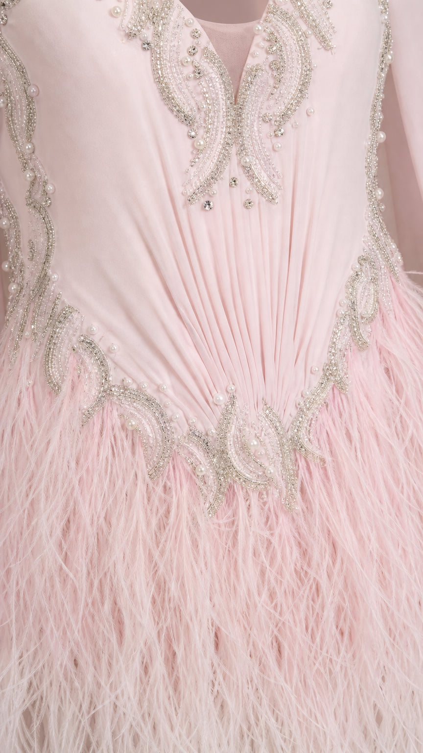 Close-up detail of silver beadwork and soft feather-fringe texture on Blush Pink gown