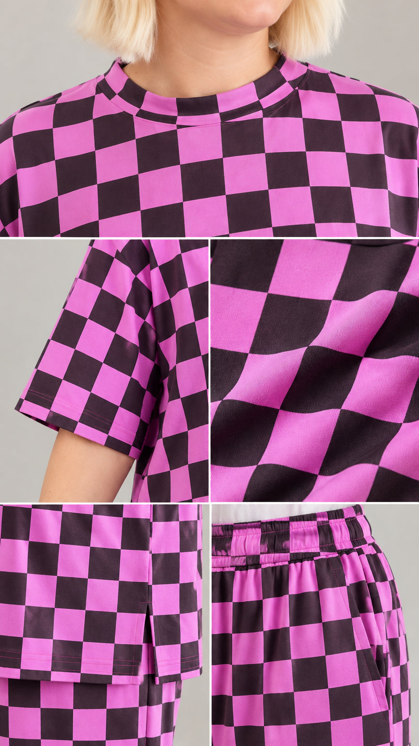 Close-up details of crew neckline, sleeve hem, side split hem, and elastic waistband