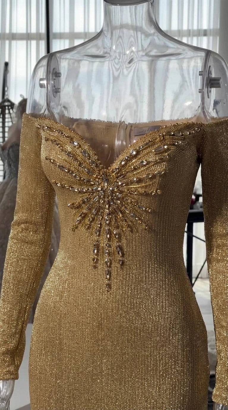 Close-up of beaded starburst detail on sweetheart neckline of gold gown