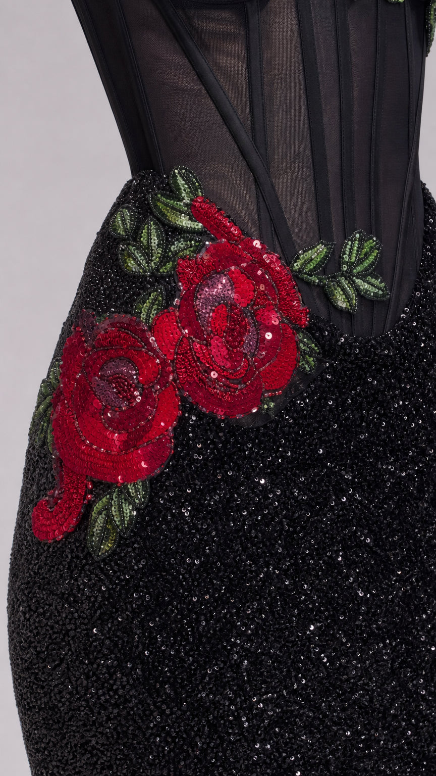 Close up of red floral rose embroidery and boned mesh bodice on black sequin dress