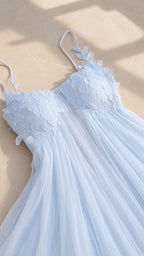 Close-up detail of light blue sweetheart bodice with intricate 3D floral lace appliques