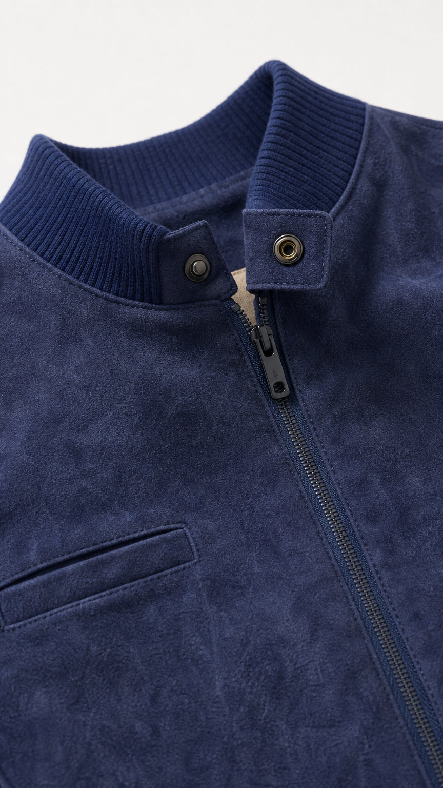 Close-up detail of Navy Blue faux suede collar, snap tab, zipper, and pocket