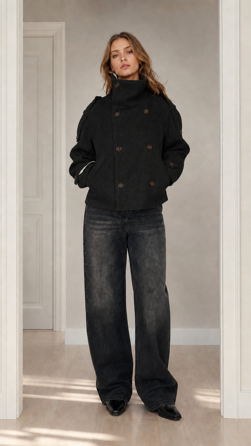 Front view of woman wearing black double-breasted stand collar short wool coat