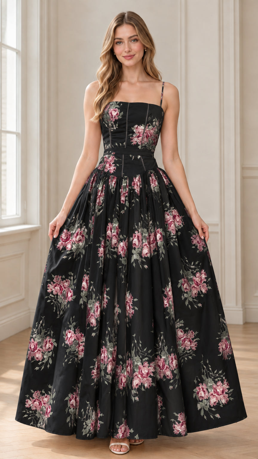 Full-length front view of model wearing black floral corset maxi dress