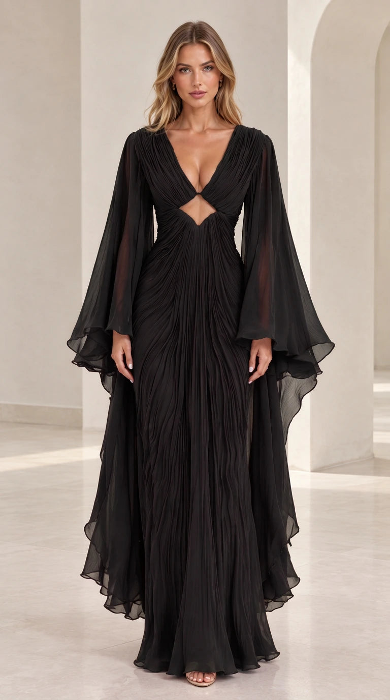 Front view of model wearing black pleated V-neck evening maxi gown with bell sleeves