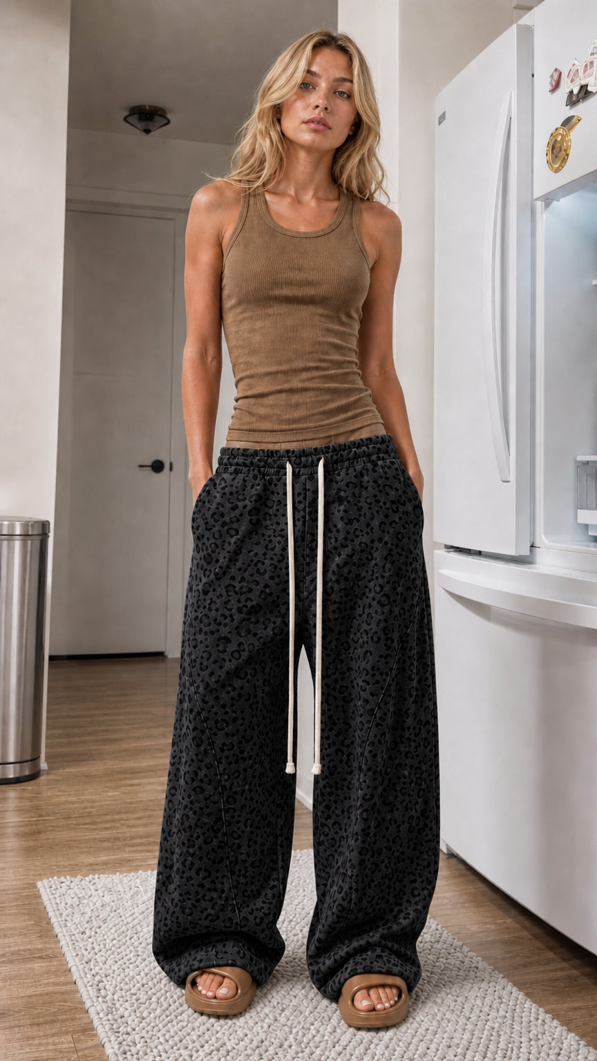 Front view of woman wearing Charcoal Black leopard print wide-leg sweatpants