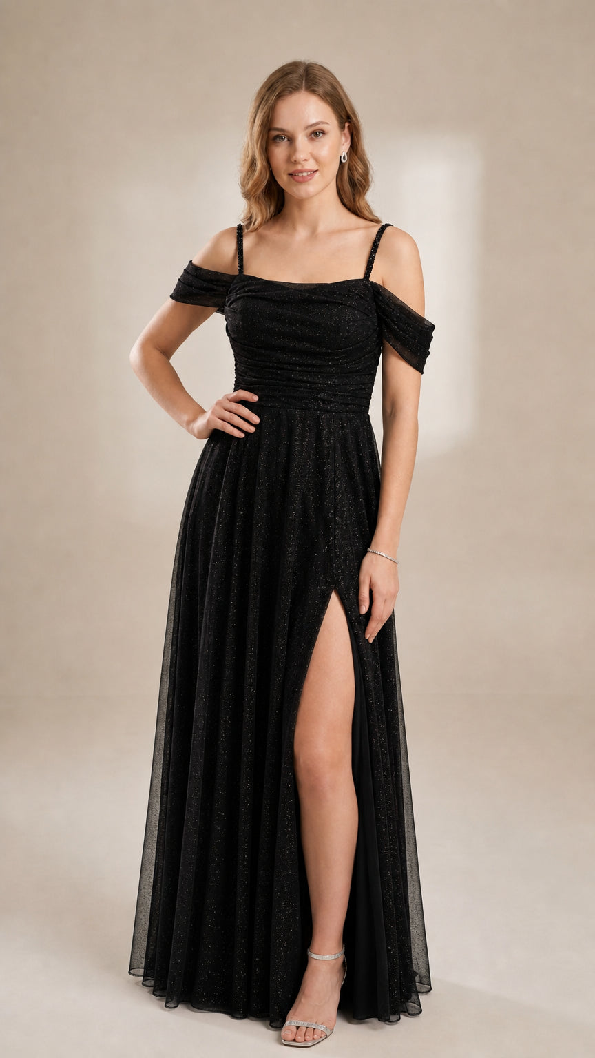 Model in a classic black glitter mesh off-the-shoulder evening dress with side slit