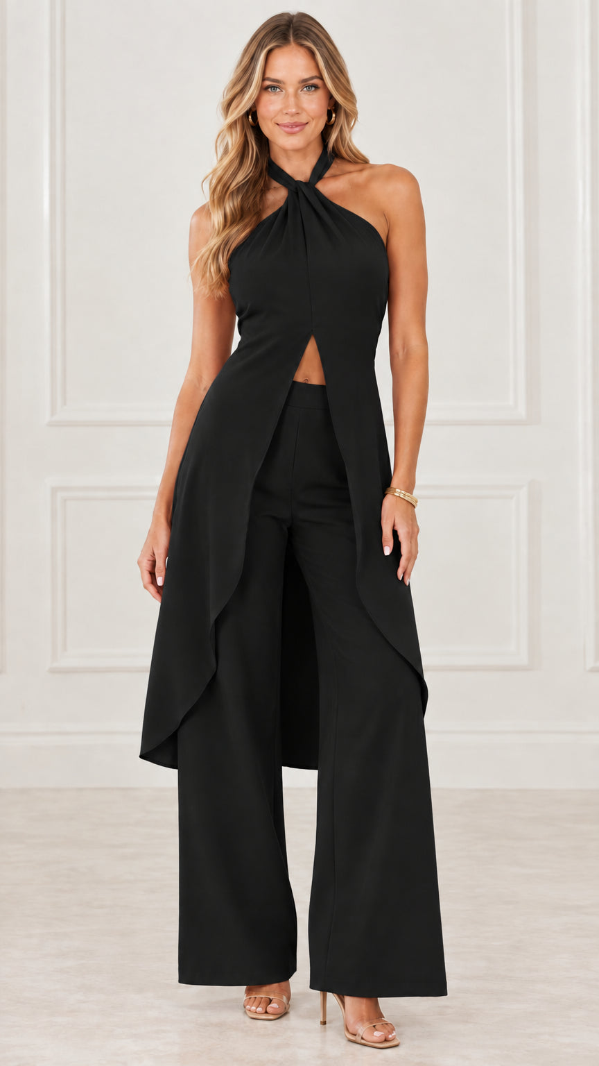 Model wearing black halter neck split drape top and wide leg trousers set