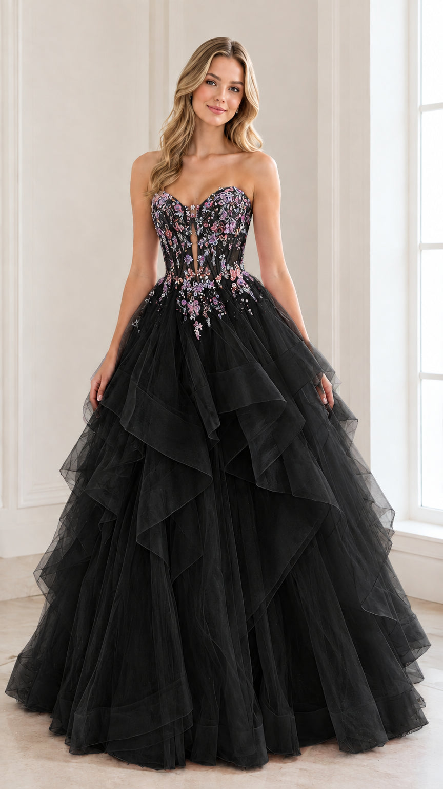 Front view of woman wearing a black strapless tiered tulle ball gown with colorful beaded bodice