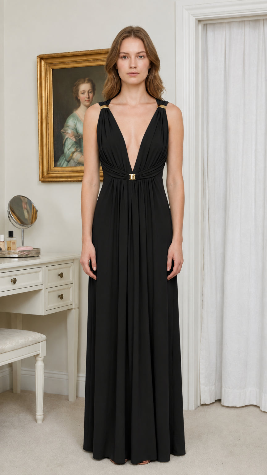Front view of model wearing black deep V-neck pleated empire maxi dress
