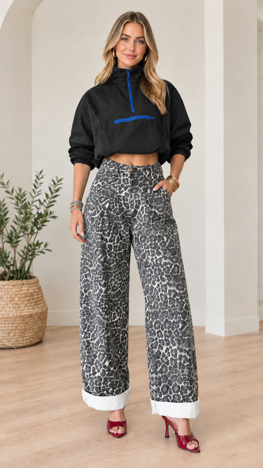 Front full view of black cropped half-zip windbreaker paired with leopard print wide-leg pants